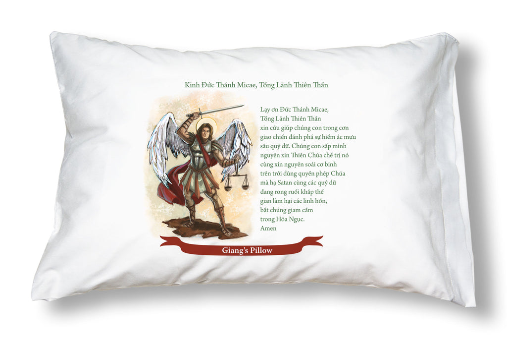 Detail of white pillowcase with a picture of St. Michael and Catholic prayer in Vietnamese.